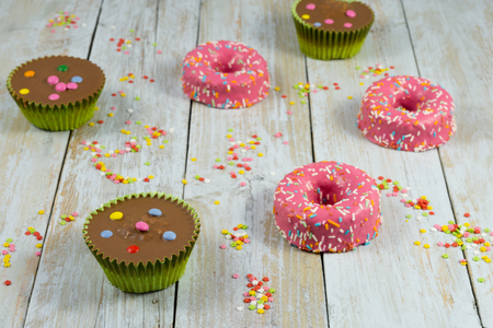 Composition made with muffins, donuts and sugar starsの写真素材