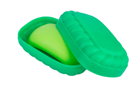 Green soap in the soap dish green. On white, isolated background.の写真素材