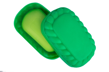 Green soap in the soap dish green. On white, isolated background. Top view. Flat lay.の写真素材