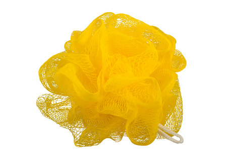 Yellow washcloth for the body. On white, isolated background.の写真素材