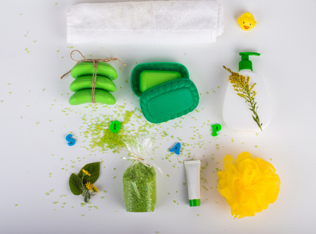 Bath set, green-yellow color. With inscription soap. On a light background. Top view. Flat lay.の写真素材