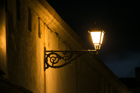 Retro lantern on wall - street lights at nightの写真素材