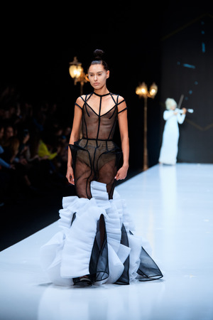 MOSCOW, RUSSIA - OCTOBER 13, 2016: Model walk runway for DIMANEU catwalk at Spring-summer 2017...