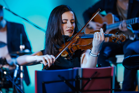 MOSCOW, RUSSIA - JANUARY 27, 2017: R&B soul band GAYANA performing live at the St. Andrews Anglican Church on January 27, 2017 in Moscow, Russia. Acoustic perfomance with the string quartet, piano and the great scenic light.のeditorial素材