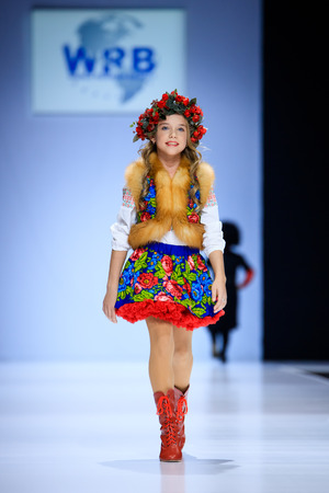 MOSCOW, RUSSIA - OCTOBER 19, 2016: Model walk runway for WORLD RUSSIAN BEAUTY catwalk at Spring-summer 2017 Moscow Fashion Week. Clothes in national ethnic style.のeditorial素材