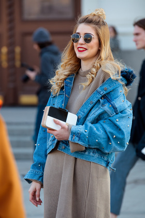 MOSCOW, RUSSIA - MARCH 14, 2017: People demonstrating street style fashion near Moscow Manege at Mercedes-Benz Fashion Week Russia.のeditorial素材