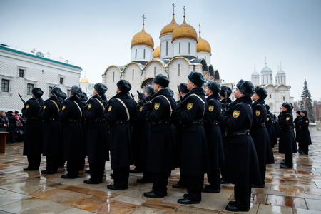 MOSCOW, RUSSIA - DECEMBER 09, 2017: Formation of the Presidential Regiment of the Service of Moscow Kremlinâs Commandant of the Federal Guard Service of the Russian Federation. Winter view.Cathedral Square, Kremlin, Moscow.のeditorial素材