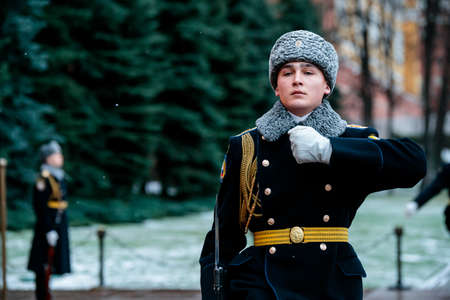 MOSCOW, RUSSIA - DECEMBER 04, 2019: Hourly change of the Presidential guard of Russia at the Tomb of Unknown soldier and Eternal flame in Alexander garden near Kremlin wall in winter uniformのeditorial素材