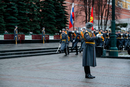 MOSCOW, RUSSIA - DECEMBER 04, 2019: March-past (parade) of the The Honor Guard of the 154 Preobrazhensky Regiment at the Tomb of Unknown soldier and Eternal flame in Alexander garden near Kremlin wallのeditorial素材