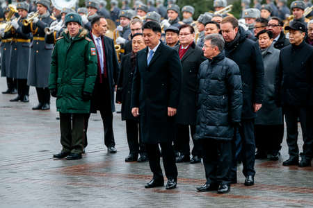 MOSCOW, RUSSIA - DECEMBER 04, 2019: Prime Minister of Mongolia Ukhnaagiin Khurelsukh with Soldiers of the Honor Guard laid a wreath at the Tomb of the Unknown Soldier near the Kremlin Wallのeditorial素材