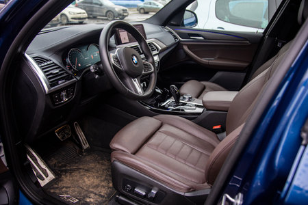 MOSCOW, RUSSIA - DECEMBER 7, 2919: empty interior of the modern premium BMW H3 M series car. driver's seat. dirty interior, carpets in the mud. close-up, soft focusのeditorial素材