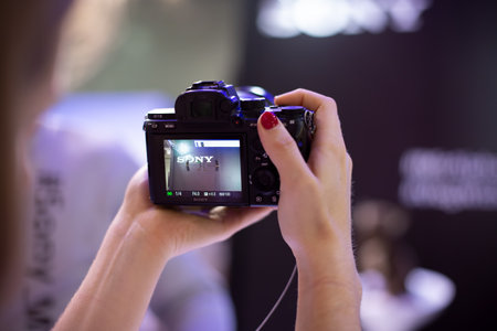 Moscow, Russia - October 04, 2019: Moscow, Russia - October 04, 2019: new mirror less camera sony alpha a7 iii 3 in womans hands pointing at sony inscriptionのeditorial素材
