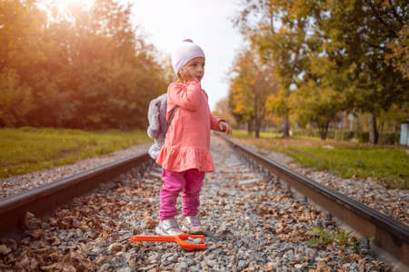 lost child left home walking on the railroad tracks.