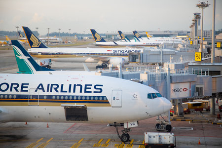 SINGAPORE - FEBRUARY 11, 2020: Singapore Airlines aircraft stand, loaded and serviced at the Jet bridge of changi airportのeditorial素材