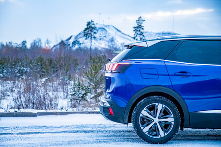 MOSCOW, RUSSIA - MARCH 15, 2020: back of Blue SUV Peugeot 3008 on on on winter countryside landscape