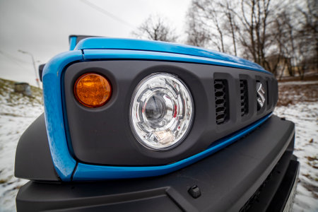 Moscow, Russia - January 24, 2020: Front optics of the new mini SUV Suzuki Jimny Static Photos in winter forest. close-upのeditorial素材