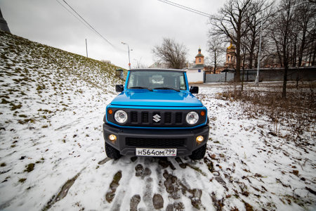 Moscow, Russia - January 24, 2020: Front view of hood and headlights of the new Suzuki Jimny Static Photos mini SUV in winter forest. close-upのeditorial素材