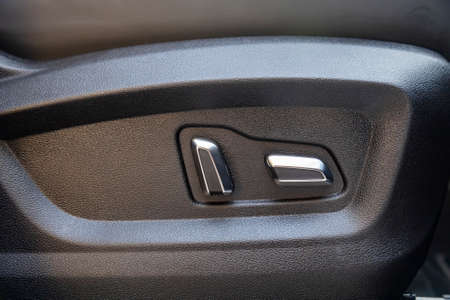 car seat electronic switch button. lever for electronic seat adjustment in a modern premium car. seat memory optionの写真素材