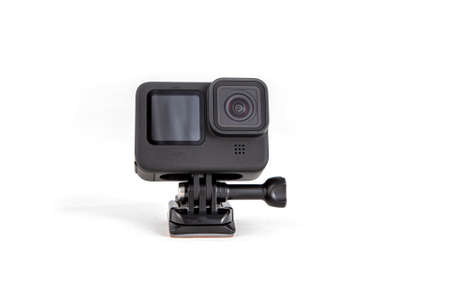 New 4K action camera on a suction mount in black color. Isolated on white background