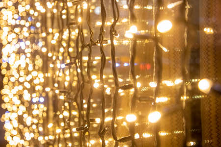 yellow wall garland perspective close-up soft focus Festive blurred backdropの写真素材
