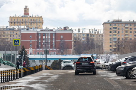 moscow, russia - March, 18, 2021: new lagre chineese minivan chery tiggo 8 pro riding city street road. back viewのeditorial素材