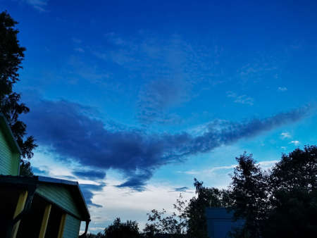 beautiful clouds on the sky covering the sun. deep blue sky