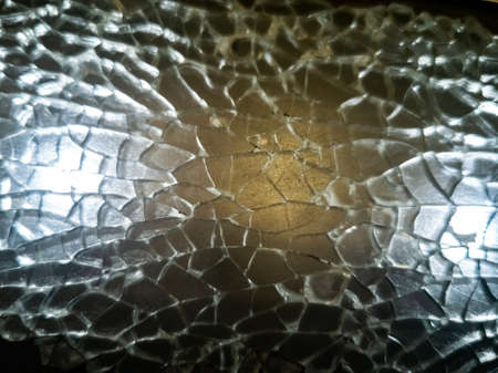 texture broken glass window shards highlighted. close-up selective focus