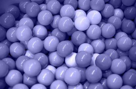 Texture: pastel color plastic balls toned with very peri. close up, soft focus