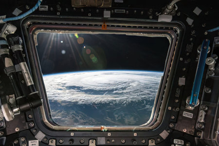 A stunning view of Earth seen from the window of a spacecraft in space.