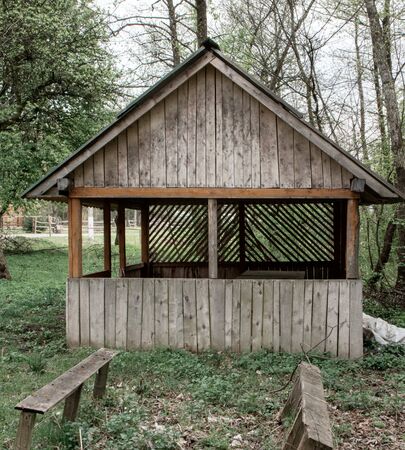 Small European-style resort wooden house or wooden hut in forest Old wooden house. Old wood in the countryside. Near is beautiful forestの写真素材