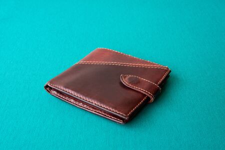 Empty wallet with no money in the background. Bankruptcy is an empty wallet. It is not possible to repay the loan and mortgage. Old and empty brown walletの写真素材