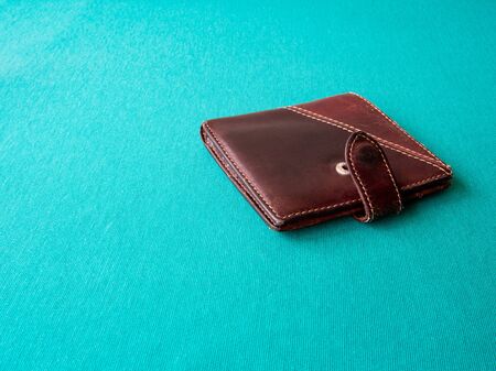 Empty wallet with no money in the background. Bankruptcy is an empty wallet. It is not possible to repay the loan and mortgage. Old and empty brown walletの写真素材