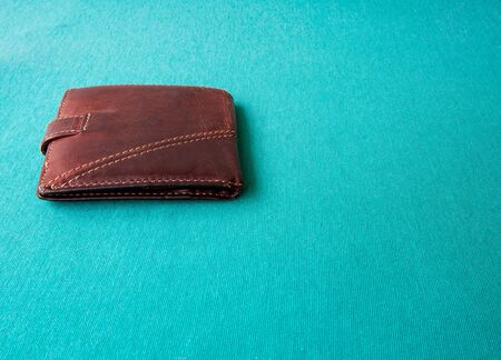 Empty wallet with no money in the background. Bankruptcy is an empty wallet. It is not possible to repay the loan and mortgage. Old and empty brown walletの写真素材