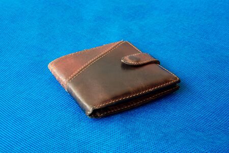Empty wallet with no money in the background. Bankruptcy is an empty wallet. It is not possible to repay the loan and mortgage. Old and empty brown walletの写真素材