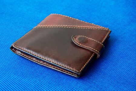 Empty wallet with no money in the background. Bankruptcy is an empty wallet. It is not possible to repay the loan and mortgage. Old and empty brown walletの写真素材