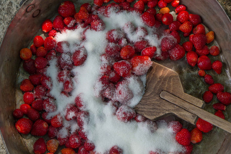 Fresh organic strawberries on an old wooden surface.の写真素材