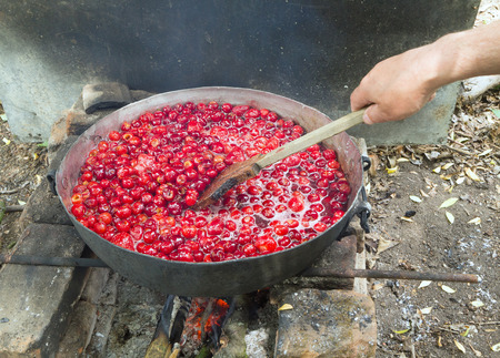 Top view of a pot with fresh cherries.の写真素材
