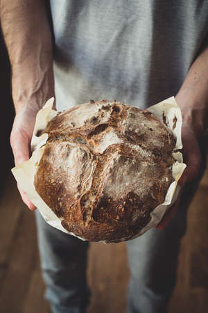 Sourdough bread - Sourdough bread in men's hands