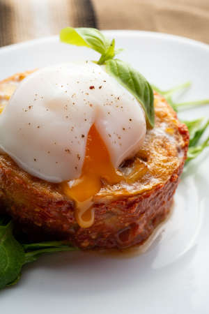 Potato omelette with poached egg