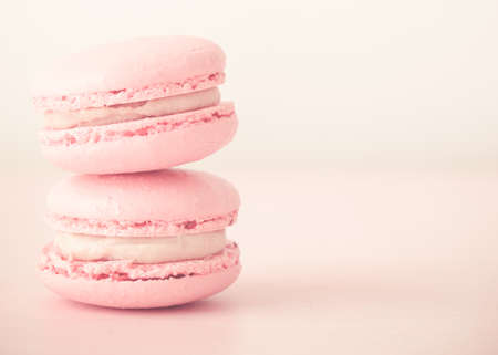 Pink macaroons close-up. Horizontal photos. Delicious macaroons. Stack of two macaroons.の写真素材