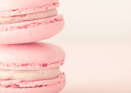 Pink macaroons close-up. Horizontal photos. Delicious macaroons. Stack of two macaroons.