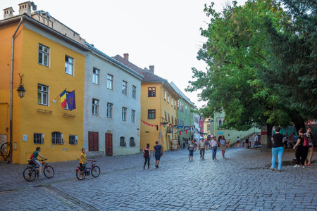 Sighisoara, Romania - August, 2019: Beautiful colorful houses in center of Sighisoara in typical traditional style. This town is the place Dracula is born. Medieval city in the middle of Transylvania.のeditorial素材