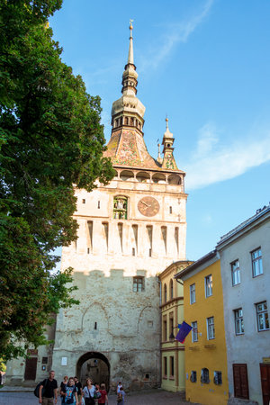 Sighisoara, Romania - August, 2019: Age citadel, located in the historic region of Transylvania. Clock tower or tower of the Town Hall and medieval architecture in the center of Sighisoara in Romaniaのeditorial素材