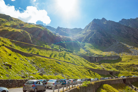Sibiu, Romania - August, 2019: Panoramic mountain road Transfagarasan, the most beautiful road, Romania Transfagarash Ridge Fagaras. Carpathian mountains, Transylvania. Summer sunday traffic jamのeditorial素材