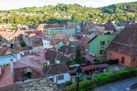 Sighisoara, Romania - August, 2019: Beautiful colorful houses in Sighisoara in typical traditional style. The town of Draculas born. Amazing medieval city in the midle of Transylvania. Panoramic viewのeditorial素材