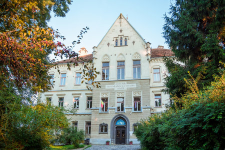 Sighisoara, Romania - August, 2019: majestic facade of a medieval Catholic school on the territory of the citadel of the ancient town of Sighisoara, province of Transylvania, Romaniaのeditorial素材