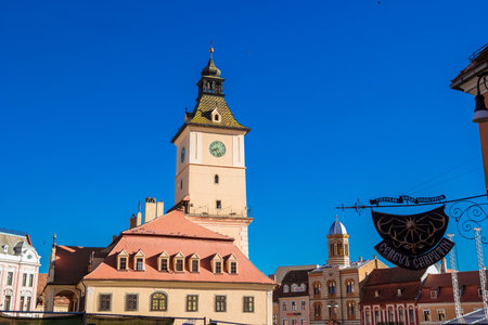 Brasov, Romania - August, 2019: Town Hall of Brasov city on sunny summer day. Medieval Council House in the Main Square of the Old Town. Piata Sfatului. old city in Transylvania, Eastern Europe.のeditorial素材