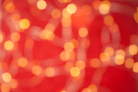 Blurred christmas background. Red bokeh abstract light backdrop. Beautiful images from steam and lights. Magic light bokehの写真素材