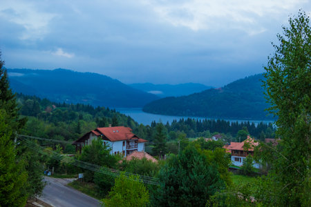 Landscape of Lake Bicaz with Ceahlau Massif on the background. Beautiful evening view of Lakul Izvorul Muntelui, Lake Bicaz, Eastern Carpathians, the biggest artificial lake in Romania. transylvania.の写真素材