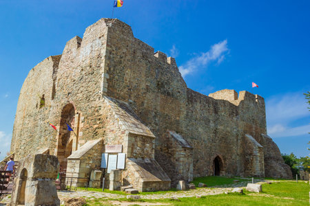 Targu Neamt, Romania - August, 2019: Cetatea Neamt, a place filled with history. the Neamt Citadel under the cloudy blue sky. It is a medieval fortress located in north-eastern part of Romania.のeditorial素材